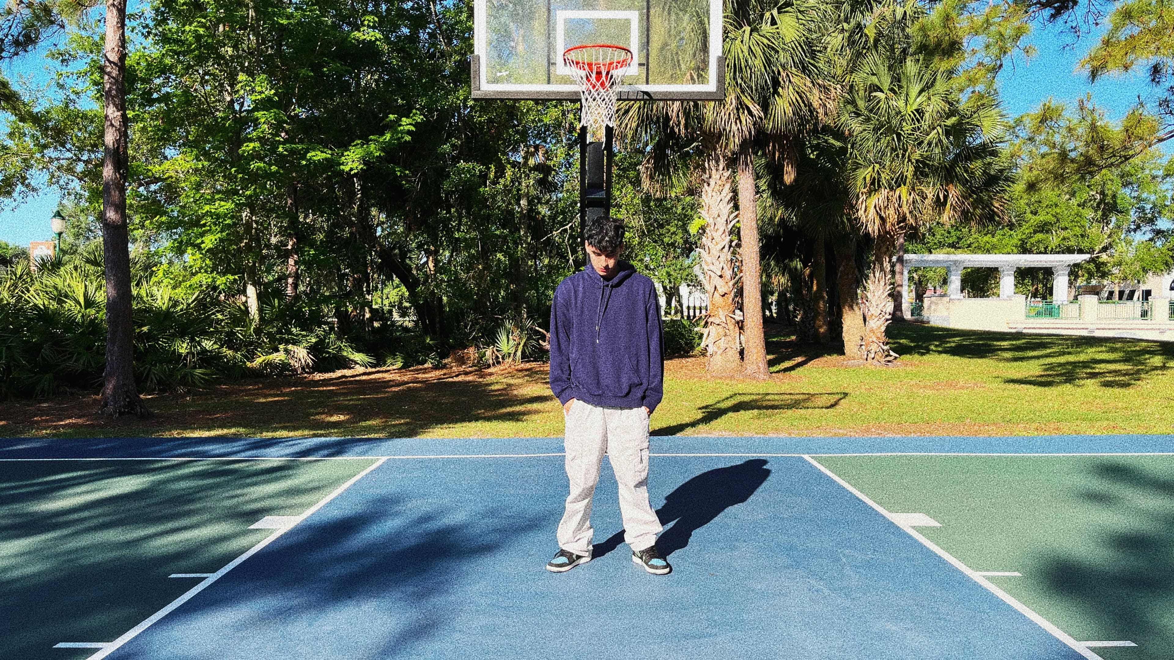 Santiago Rodriguez standing confidently, looking toward the future
